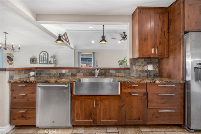 2731 N Rutgers Ave, Long Beach, CA 90815 - kitchen with stainless steel appliances, a sink, ceiling fan, and dark stone counters