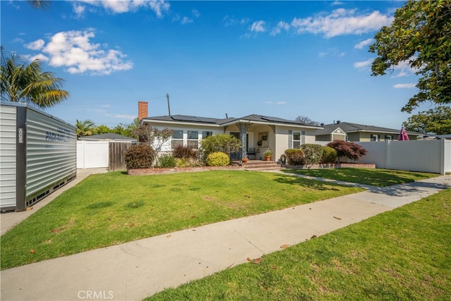 2731 N Rutgers Ave, Long Beach, CA 90815 - view of front facade with roof mounted solar panels and a chimney