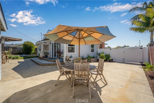 2731 N Rutgers Ave, Long Beach, CA 90815 - view of patio / terrace with a gate, a fenced backyard, and outdoor dining area