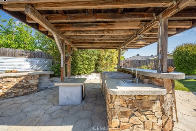 2731 N Rutgers Ave, Long Beach, CA 90815 - view of patio featuring a fenced backyard and exterior kitchen