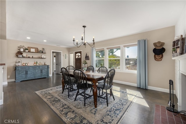 2731 N Rutgers Ave, Long Beach, CA 90815 - dining area with a chandelier, baseboards, recessed lighting, dark wood finished floors, and a fireplace with flush hearth