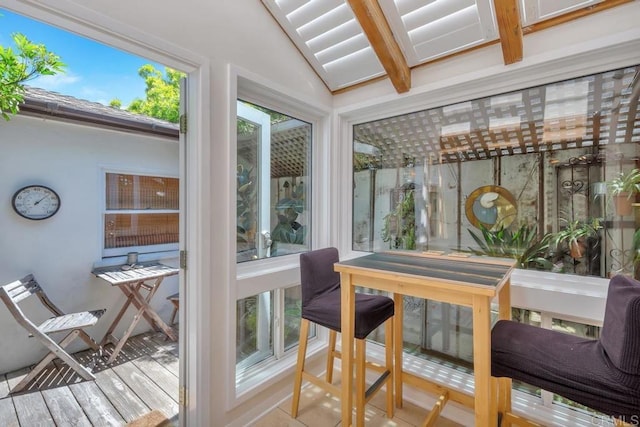 sunroom with wood finished floors and a wooden deck