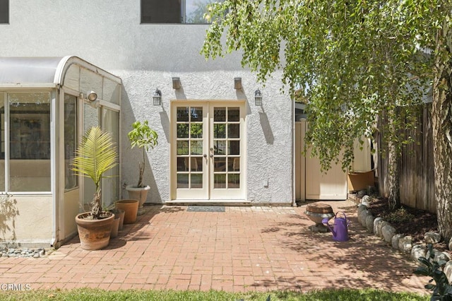 2426 Warbler Ave, Ventura, CA 93003 - property entrance featuring french doors, a patio area, stucco siding, and fence