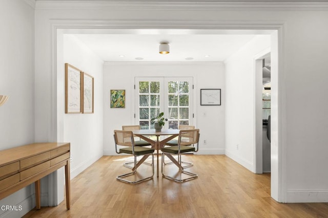 2426 Warbler Ave, Ventura, CA 93003 - dining space with light wood-style flooring, baseboards, and crown molding