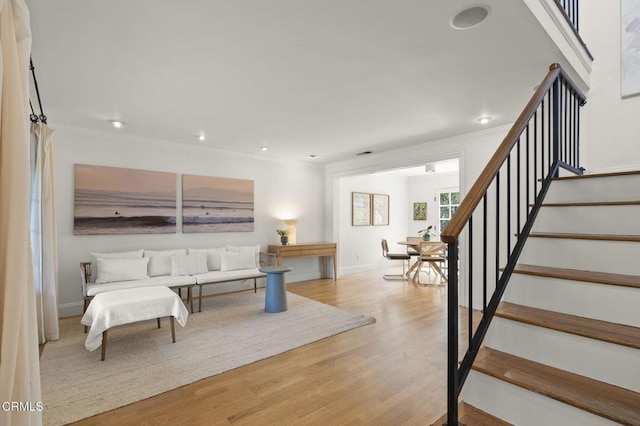 2426 Warbler Ave, Ventura, CA 93003 - living room with stairs, wood finished floors, recessed lighting, crown molding, and baseboards
