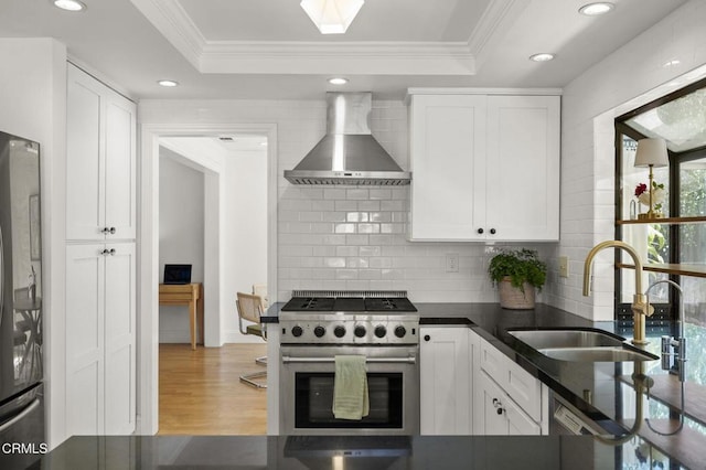 2426 Warbler Ave, Ventura, CA 93003 - kitchen featuring stainless steel stove, wall chimney exhaust hood, a sink, freestanding refrigerator, and ornamental molding