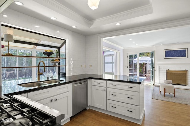 2426 Warbler Ave, Ventura, CA 93003 - kitchen featuring ornamental molding, a sink, stainless steel dishwasher, wood finished floors, and dark countertops