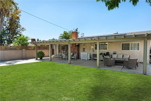 180 N De Lay Ave, Covina, CA 91723 - rear view of property featuring an outdoor hangout area, roof mounted solar panels, a chimney, a pergola, and a patio area