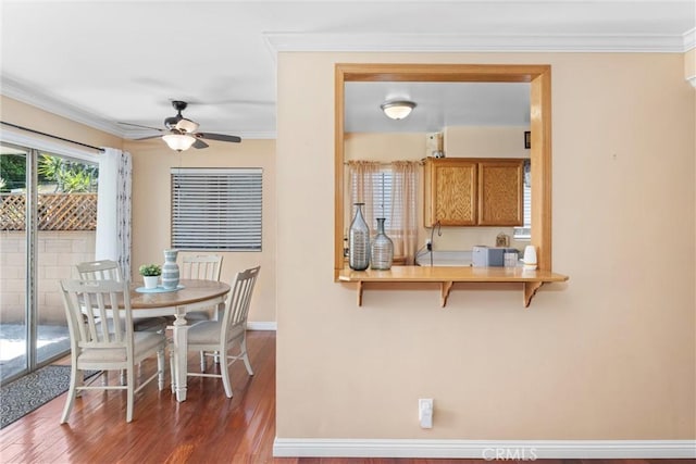 180 N De Lay Ave, Covina, CA 91723 - dining area with wood finished floors, a ceiling fan, crown molding, and baseboards