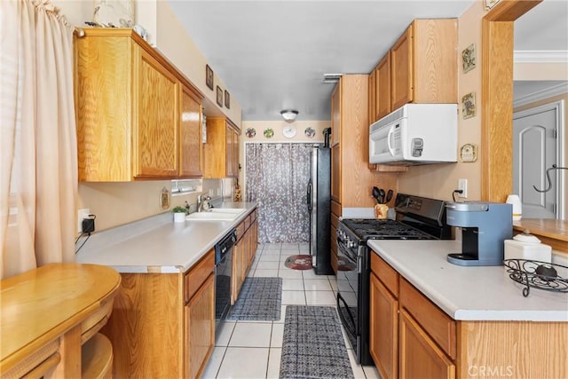180 N De Lay Ave, Covina, CA 91723 - kitchen featuring black appliances, a sink, light tile patterned floors, and light countertops