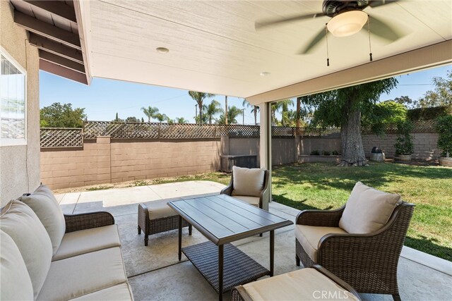 180 N De Lay Ave, Covina, CA 91723 - fenced backyard with a patio, ceiling fan, and an outdoor hangout area