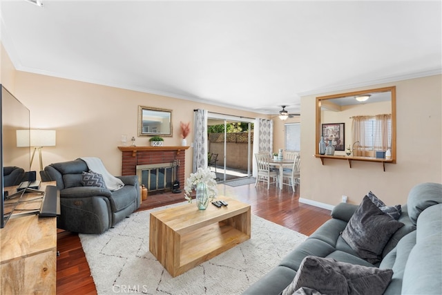 180 N De Lay Ave, Covina, CA 91723 - living area featuring crown molding, ceiling fan, wood finished floors, a brick fireplace, and baseboards