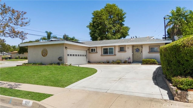 180 N De Lay Ave, Covina, CA 91723 - ranch-style home featuring stucco siding, a front yard, a garage, and concrete driveway