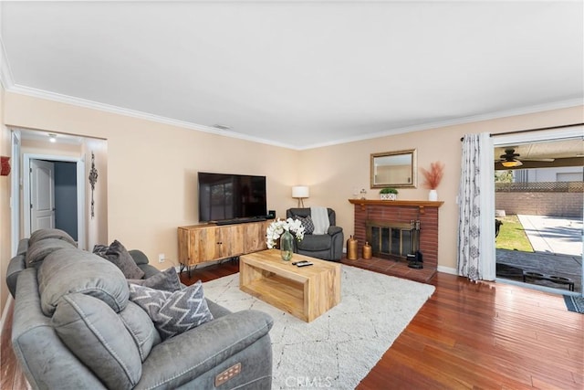 180 N De Lay Ave, Covina, CA 91723 - living room featuring ornamental molding, wood finished floors, ceiling fan, a fireplace, and baseboards