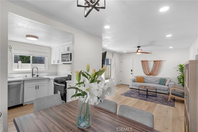 1075 Molino Ave Unit D, Long Beach, CA 90804 - dining room with ceiling fan, light wood-style flooring, and recessed lighting