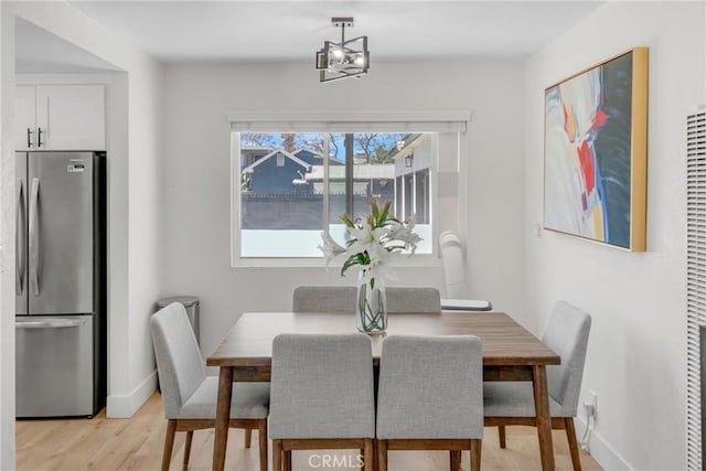 1075 Molino Ave Unit D, Long Beach, CA 90804 - dining area featuring light wood-type flooring and baseboards