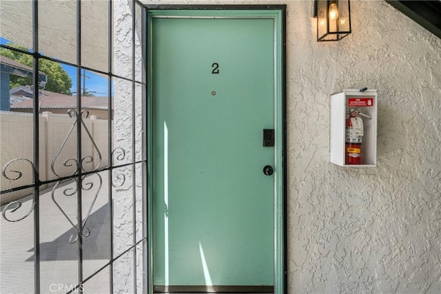1075 Molino Ave Unit D, Long Beach, CA 90804 - doorway to property featuring stucco siding