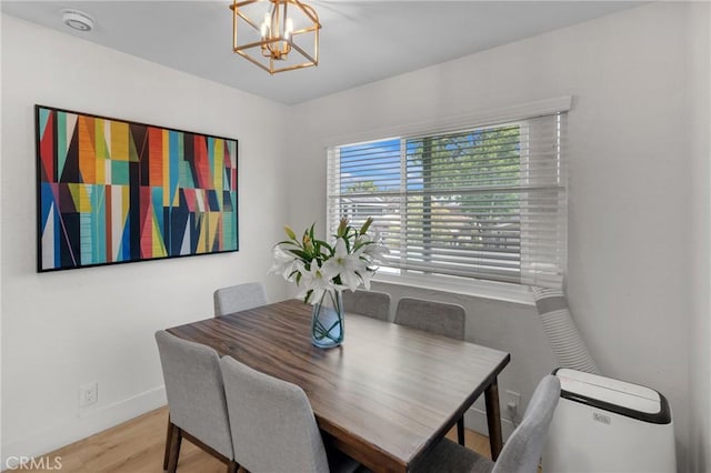 1075 Molino Ave Unit D, Long Beach, CA 90804 - dining room with a chandelier, baseboards, and wood finished floors