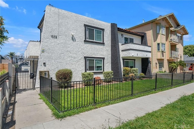 1075 Molino Ave Unit D, Long Beach, CA 90804 - view of front of house with stucco siding and a gate