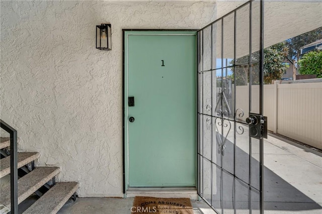 1075 Molino Ave Unit D, Long Beach, CA 90804 - doorway to property with stucco siding and fence