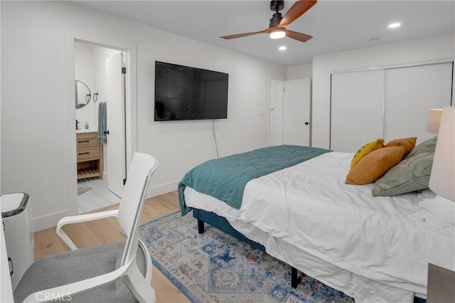 1075 Molino Ave Unit D, Long Beach, CA 90804 - bedroom with wood finished floors, recessed lighting, a closet, baseboards, and ensuite bathroom