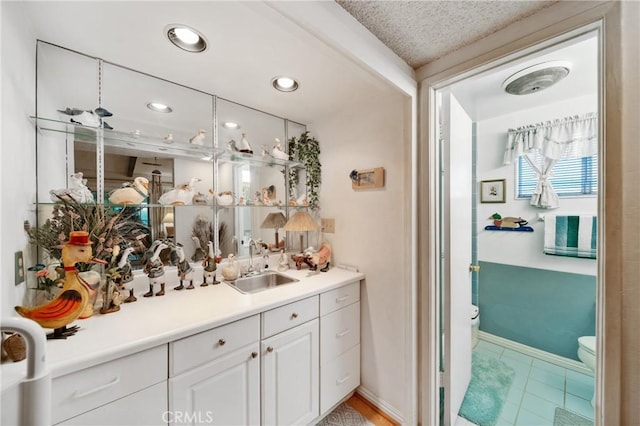 2204 Ruiz Pl, Hacienda Heights, CA 91745 - bar area featuring a sink, light tile patterned floors, and baseboards