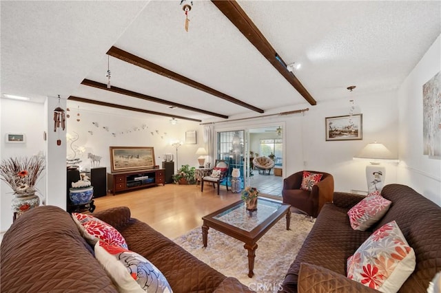 2204 Ruiz Pl, Hacienda Heights, CA 91745 - living area featuring a textured ceiling, beamed ceiling, and wood finished floors