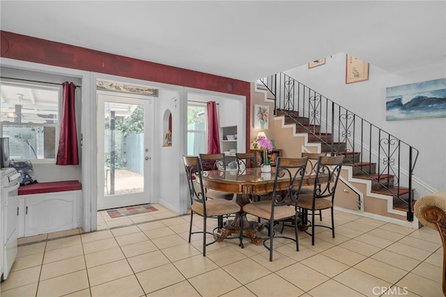 2137 N Murray St, Banning, CA 92220 - dining area featuring stairway, light tile patterned flooring, and baseboards