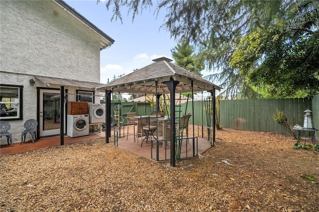 2137 N Murray St, Banning, CA 92220 - fenced backyard with washer / clothes dryer, a gazebo, and a patio