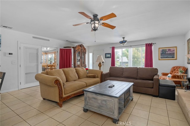 2137 N Murray St, Banning, CA 92220 - living room featuring light tile patterned floors, healthy amount of natural light, and a ceiling fan