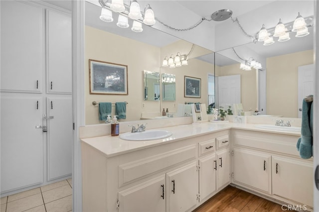 2137 N Murray St, Banning, CA 92220 - bathroom featuring double vanity, tile patterned flooring, and a chandelier