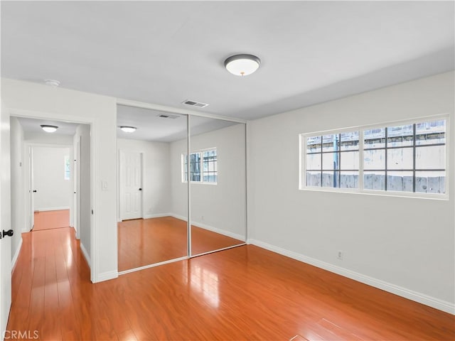 3627 Virginia St, La Crescenta, CA 91214 - unfurnished bedroom with wood finished floors, baseboards, and a closet