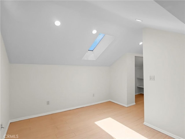 3627 Virginia St, La Crescenta, CA 91214 - bonus room with a skylight, vaulted ceiling, wood finished floors, baseboards, and recessed lighting