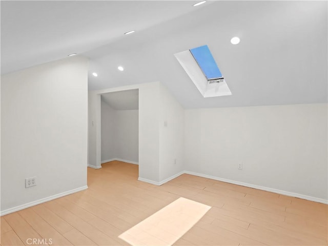 3627 Virginia St, La Crescenta, CA 91214 - additional living space with a skylight, vaulted ceiling, wood finished floors, baseboards, and recessed lighting