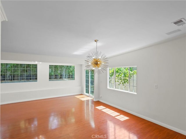 3627 Virginia St, La Crescenta, CA 91214 - empty room with a chandelier, wood finished floors, and baseboards