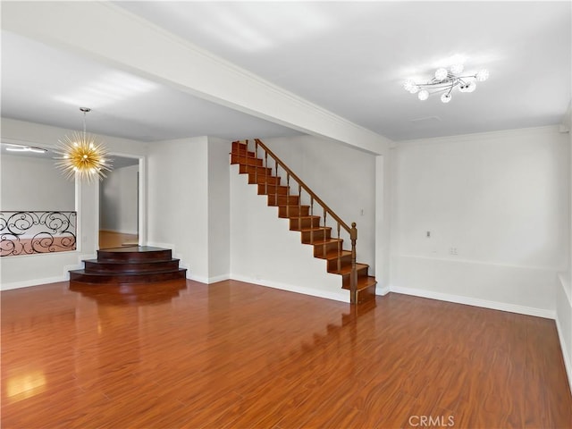 3627 Virginia St, La Crescenta, CA 91214 - unfurnished living room featuring stairway, wood finished floors, baseboards, ornamental molding, and a chandelier