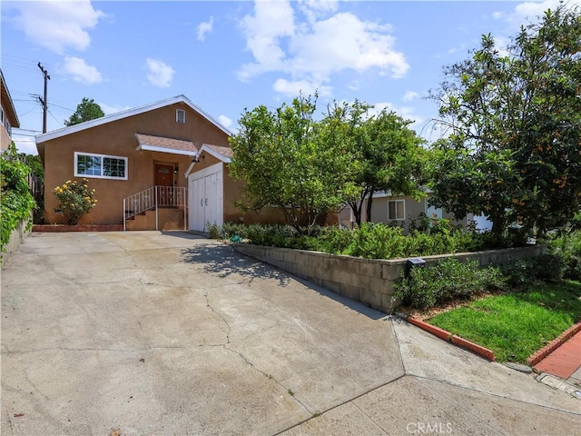3627 Virginia St, La Crescenta, CA 91214 - view of front of property featuring stucco siding and driveway
