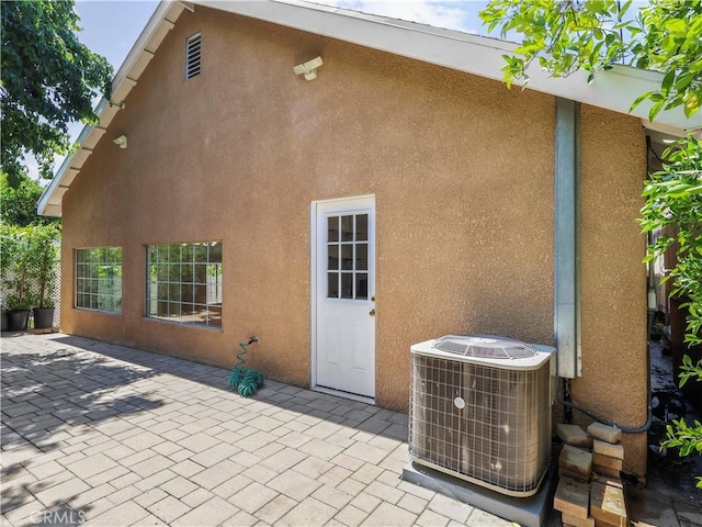 3627 Virginia St, La Crescenta, CA 91214 - back of property featuring a patio, central air condition unit, and stucco siding