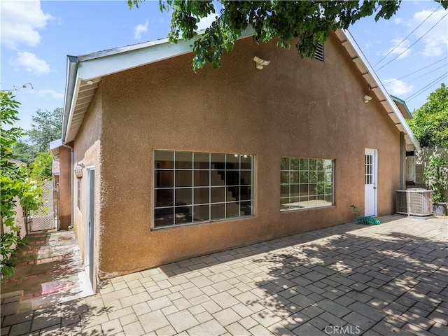 3627 Virginia St, La Crescenta, CA 91214 - back of property with stucco siding, central AC, a patio, and a gate