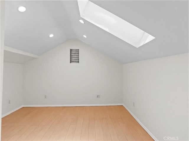 3627 Virginia St, La Crescenta, CA 91214 - additional living space with a skylight, recessed lighting, vaulted ceiling, wood finished floors, and baseboards