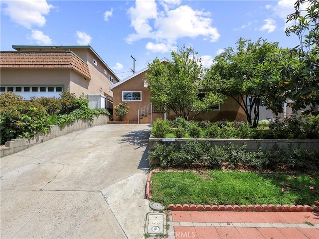 3627 Virginia St, La Crescenta, CA 91214 - view of front of house with concrete driveway and stucco siding