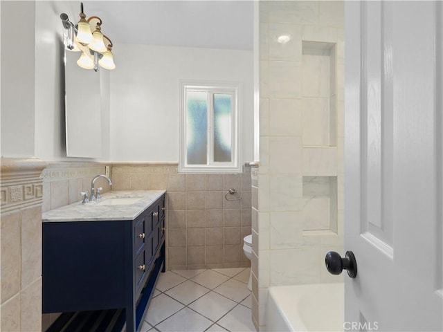 3627 Virginia St, La Crescenta, CA 91214 - bathroom featuring tile walls, tile patterned floors, vanity, toilet, and a wainscoted wall
