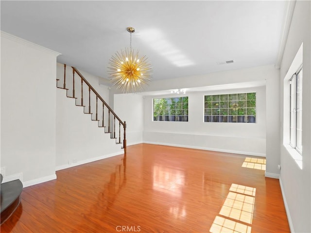 3627 Virginia St, La Crescenta, CA 91214 - unfurnished living room featuring a chandelier, wood finished floors, stairs, and baseboards