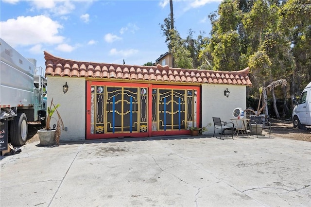 720 W La Habra Blvd, La Habra, CA 90631 - rear view of house featuring a tiled roof, stucco siding, and a patio area