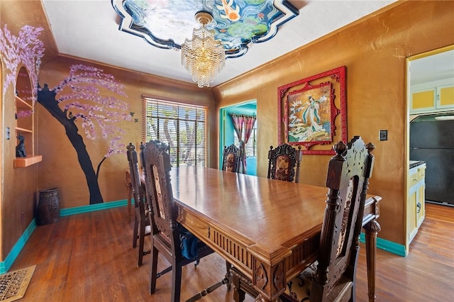 720 W La Habra Blvd, La Habra, CA 90631 - dining area with a chandelier, wood finished floors, and baseboards
