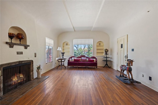 720 W La Habra Blvd, La Habra, CA 90631 - living area with built in features, a lit fireplace, wood finished floors, and baseboards
