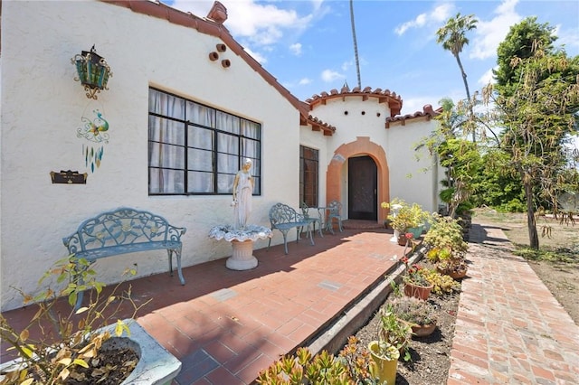 720 W La Habra Blvd, La Habra, CA 90631 - view of exterior entry featuring stucco siding and a tile roof