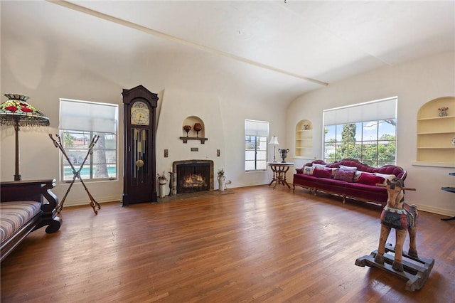 720 W La Habra Blvd, La Habra, CA 90631 - living room with built in features, wood finished floors, a lit fireplace, and baseboards