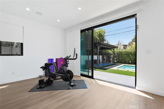 535 N Sierra Bonita Ave, Los Angeles, CA 90036 - workout room featuring wood finished floors, baseboards, and recessed lighting