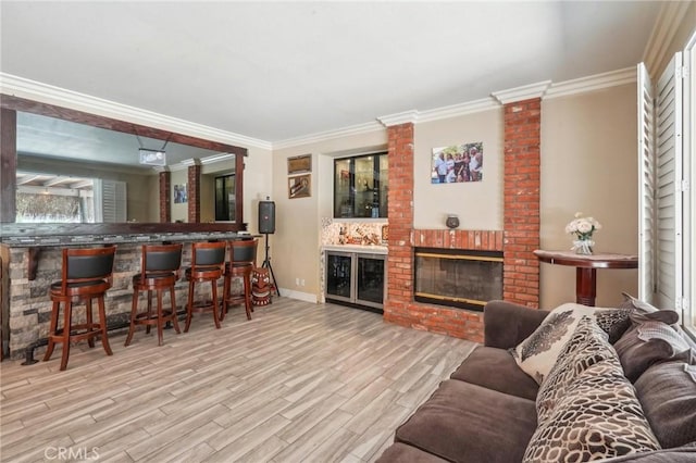 3723 Pinto Pl, Ontario, CA 91761 - living area featuring wood finished floors, baseboards, crown molding, a fireplace, and bar area